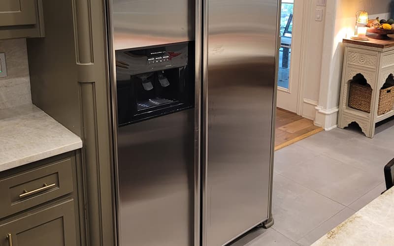 Technician replacing a freezer evaporator fan motor in Frisco, TX — same-day repair by Sensor Appliance Repair.